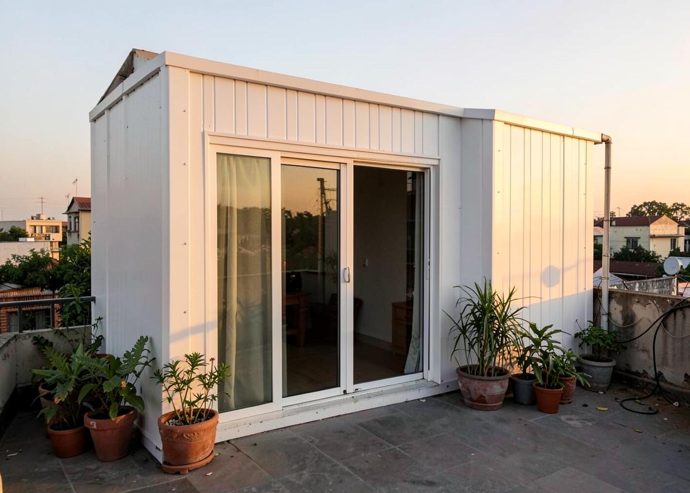 Rooftop prefab module installed above an existing building